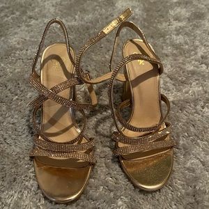 Gold sparkle strapping heels